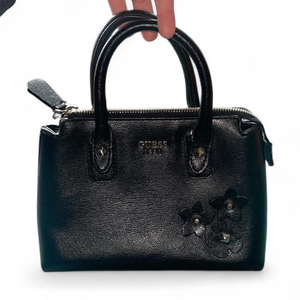 Guess— black handbag with floral accents
